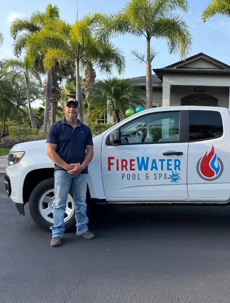 Kevin Smith of Firewater Pools standing beside a branded service truck