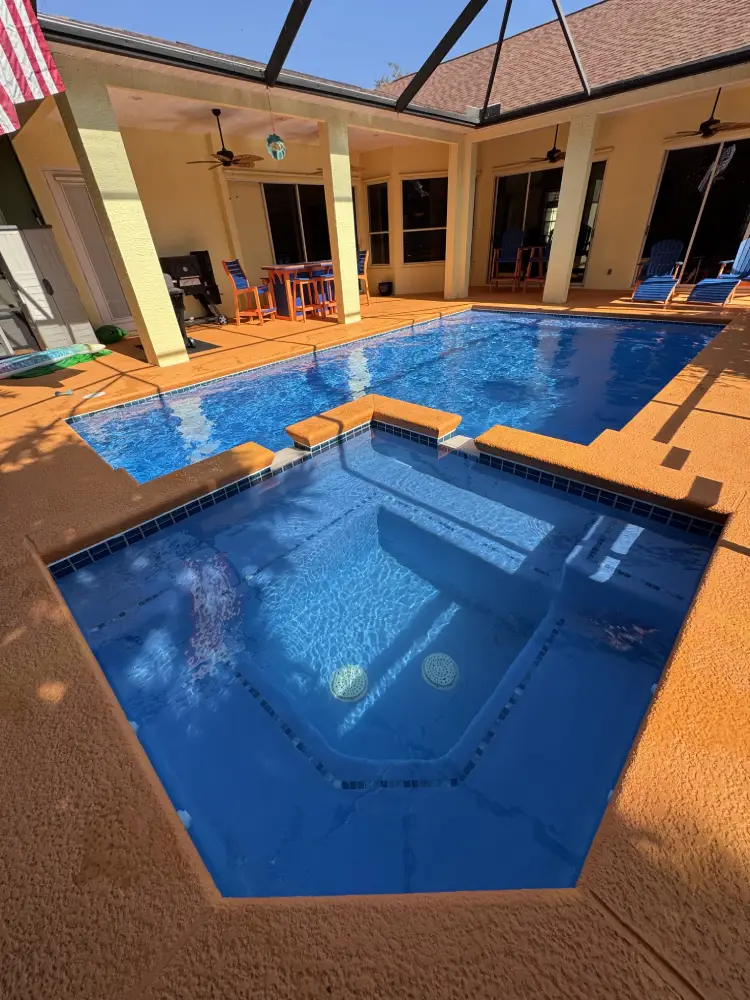 Screened backyard pool cleaning project in Port St Lucie